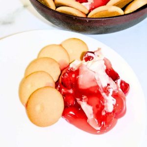 Cherry Cheesecake dip on a white plate.