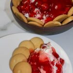 Cherry Cheesecake dip on a white plate.