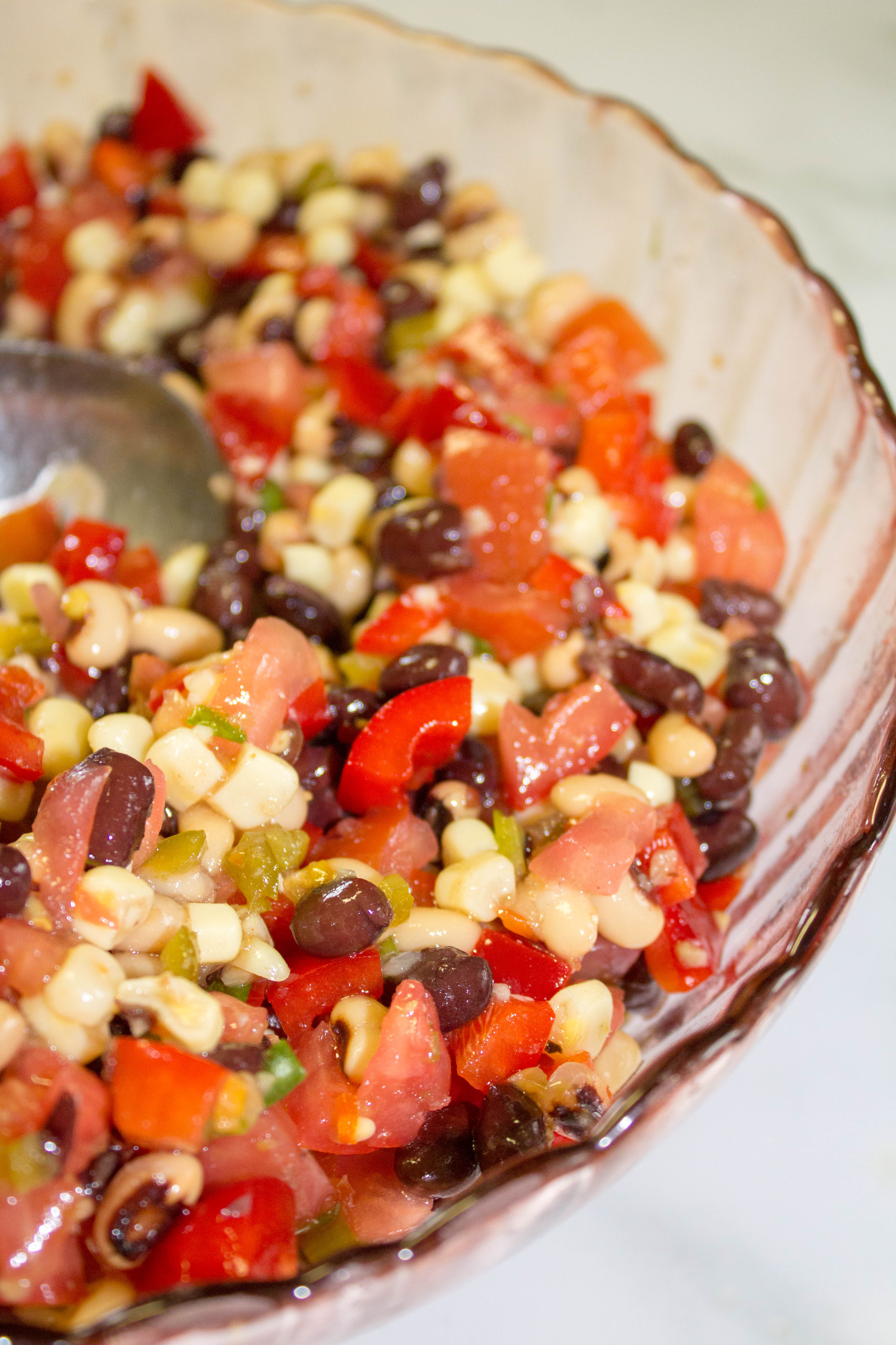 Cowboy Caviar is a flavor-packed side dish that also happens to be healthy. It makes a great salsa, dip, or salad at any picnic or get together! Naturally vegan and gluten-free.