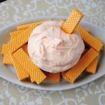 Creamsicle Fruit Dip with wafers dipped in it.