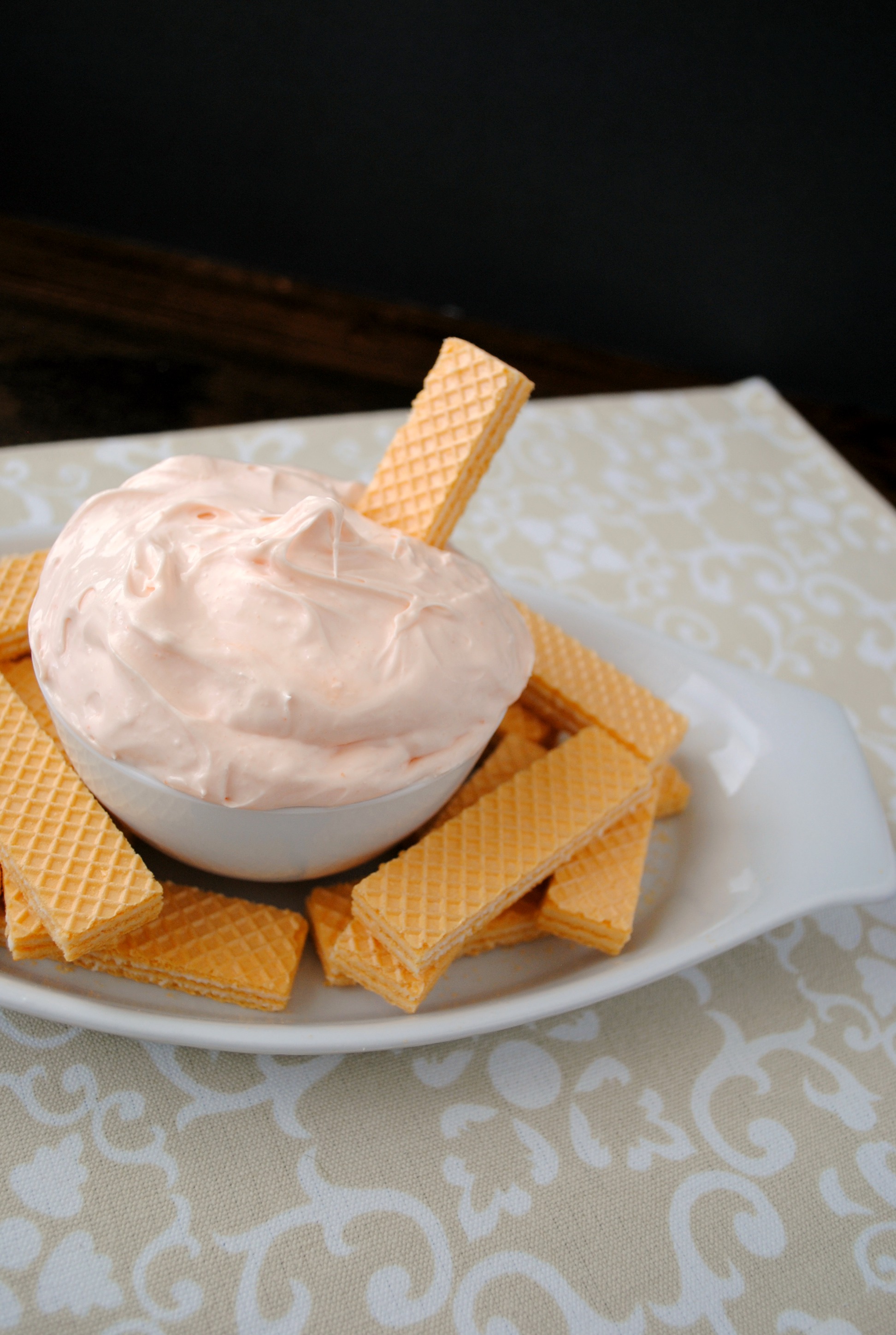 Fruit dip is a fantastic dessert. I love a cream cheese fruit dip that works with fruit or can be used as a cookie dip. Creamsicle Fluff Dip is one of those dips.