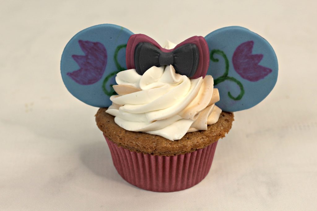 Anna Frozen cupcake with minnie ears and a bow