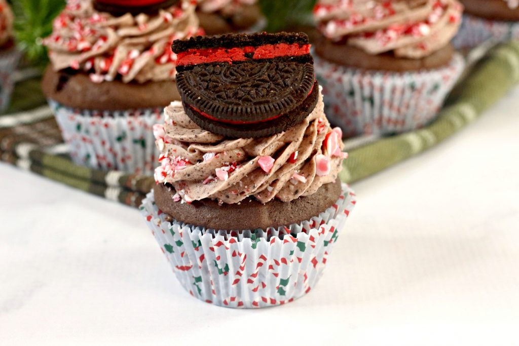 Chocolate Cupcakes with chocolate frosting and a Christmas Oreo on top