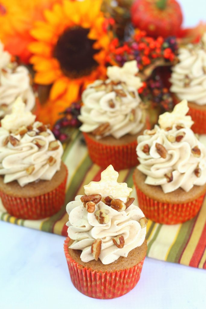 pecan pie cupcakes on a stripped napkin