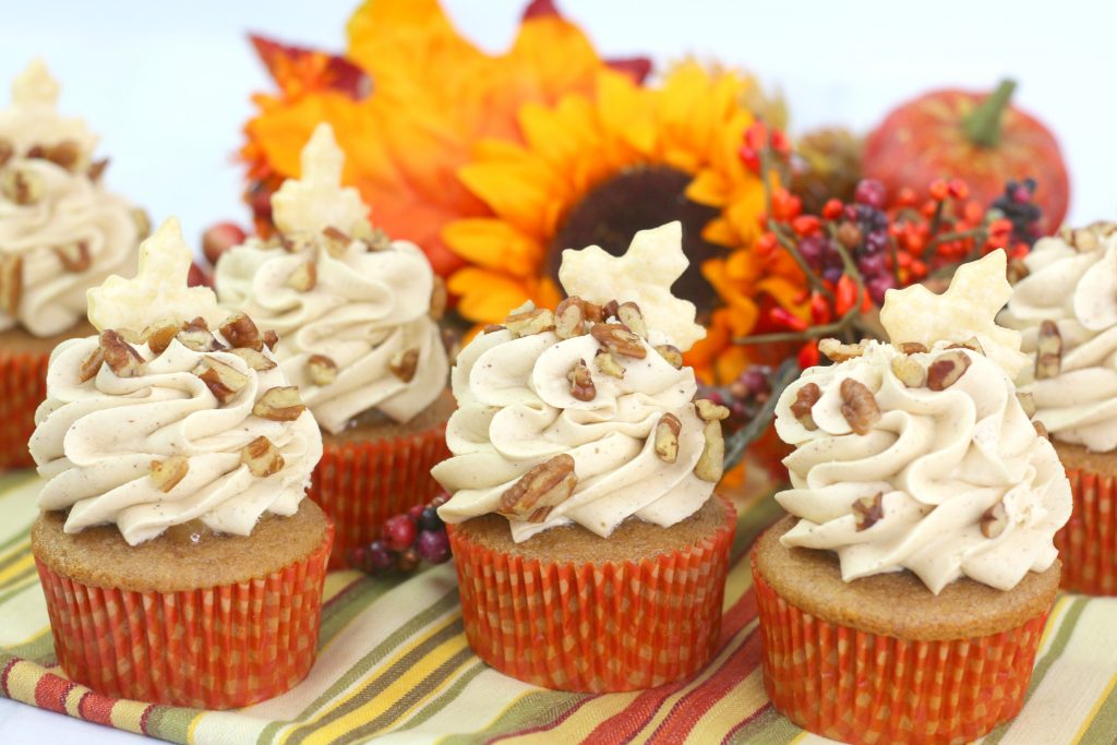 pecan pie cupcakes on a striped napkin