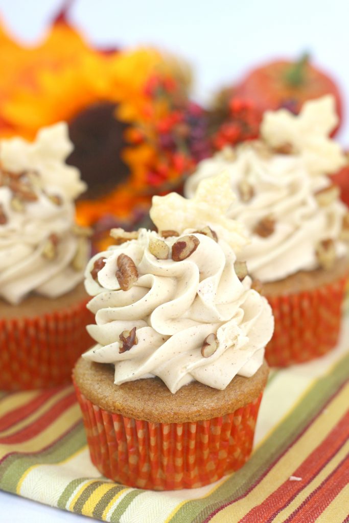 pecan pie cupcakes on a striped napkin