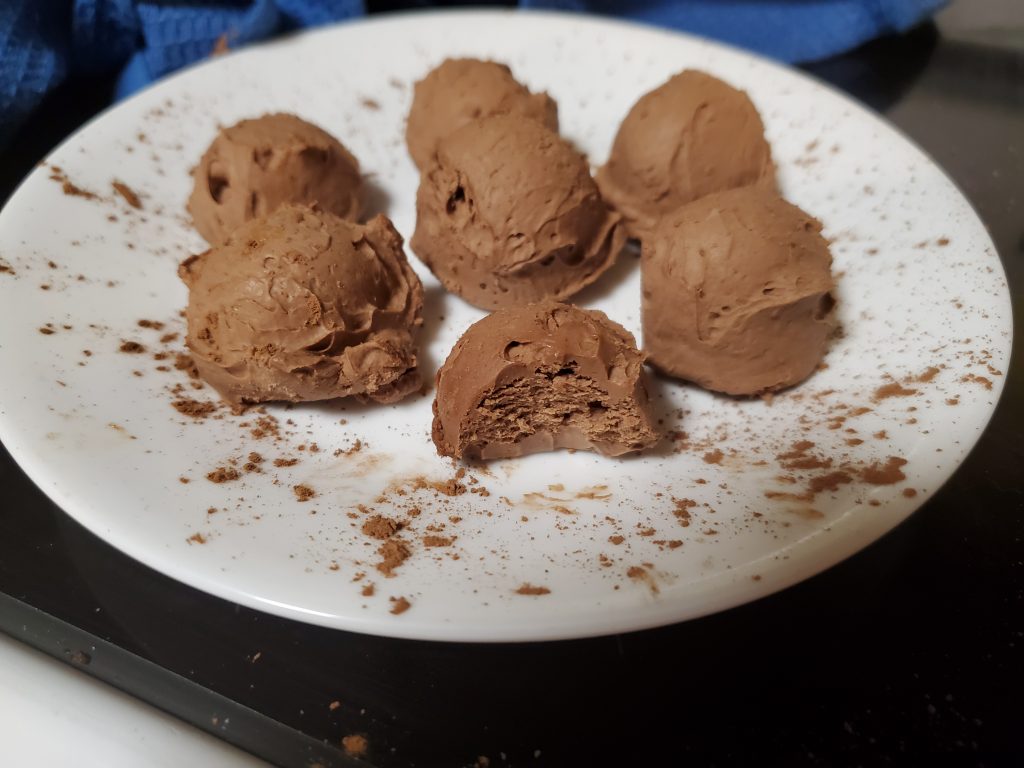 chocolate cream cheese fat bombs on a plate