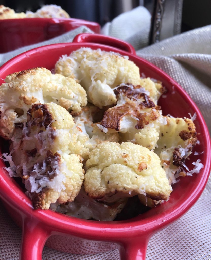 oven roasted cauliflower in a red bowl