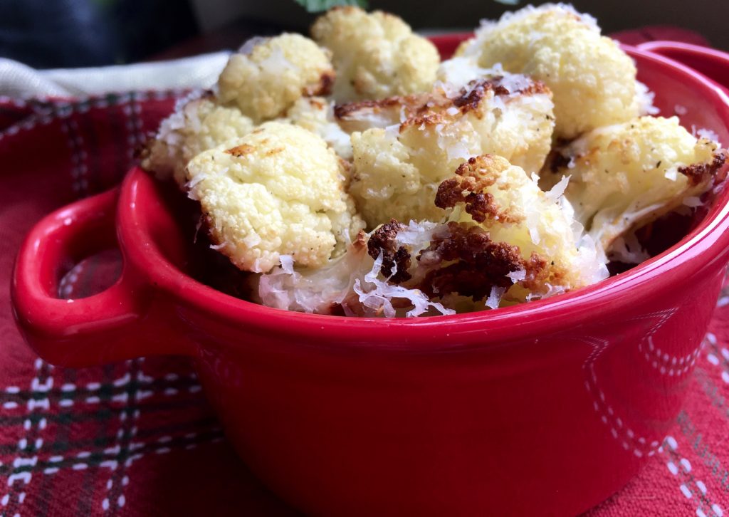 cauliflower in the oven in a red bowl