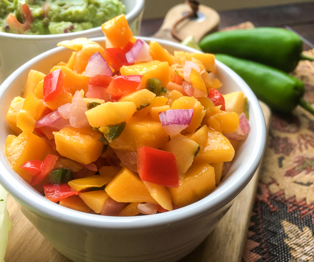 white bowl of spicy mango salsa