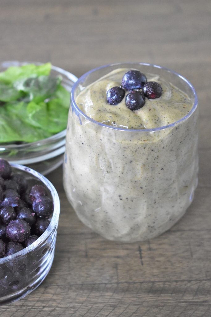 Green Spinach Smoothie in a glass cup.