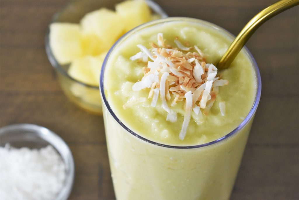 The Pineapple Avocado Smoothie topped with a garnish.