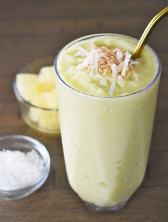 The Pineapple Avocado Smoothie with ingredients on the side.