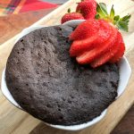 Chocolate Mug Cake with fresh strawberries.