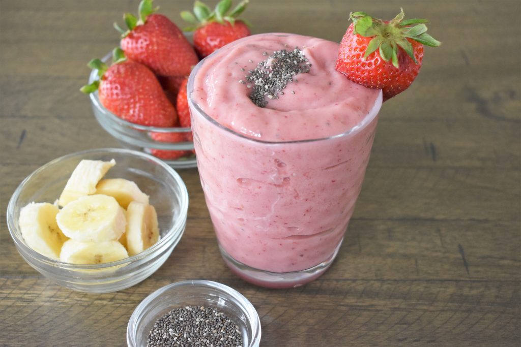 Strawberry Mango Smoothie with the ingredients next to it.