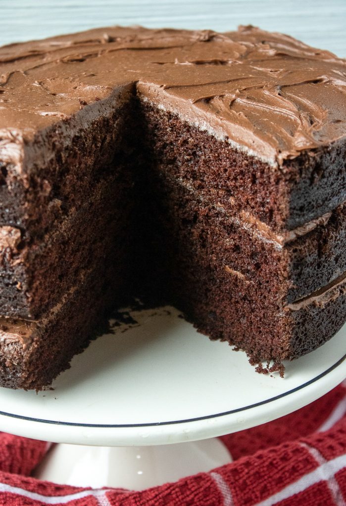 A cake layered with chocolate buttercream frosting.