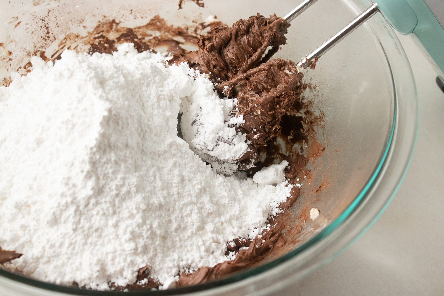 Adding in the powdered sugar.