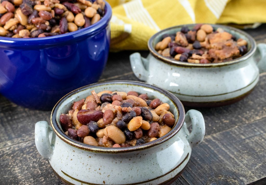 The recipe in a large blue bowl and in smaller white bowls.