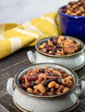 Slow Cooker Baked Beans on a wooden table.