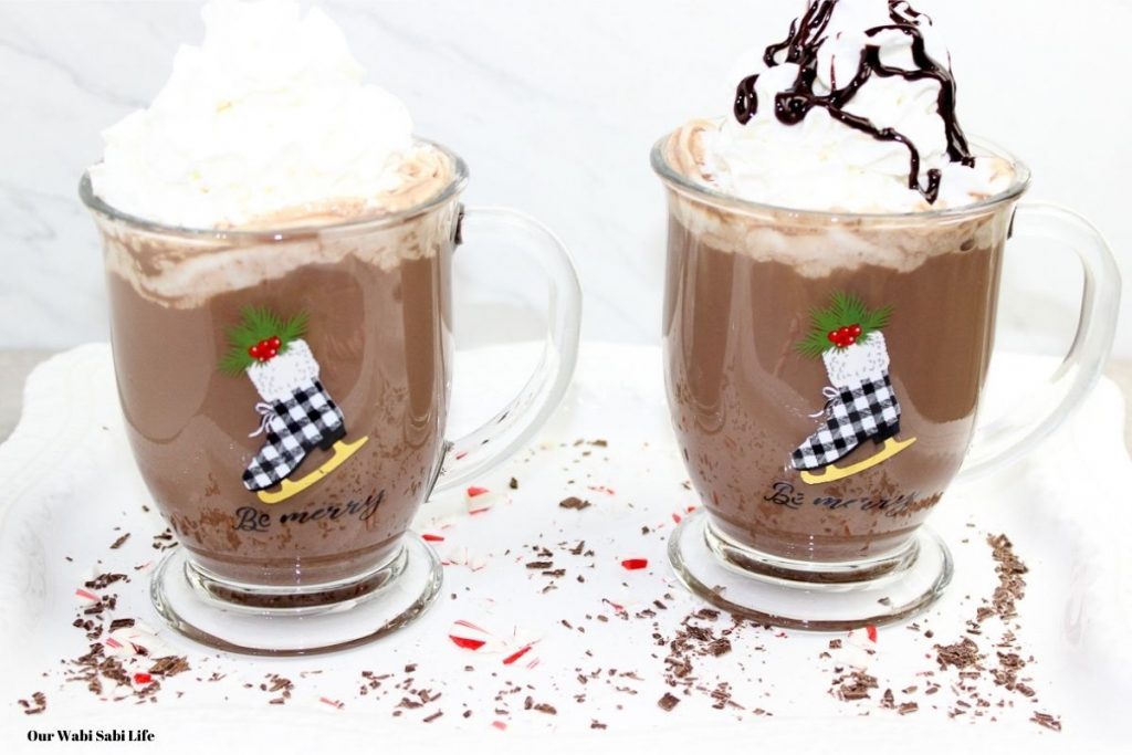 Boozy Hot Chocolate with sprinkles on the table.
