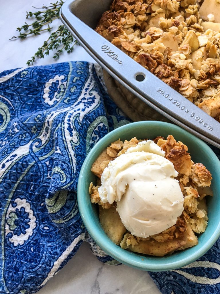 Apple Crisp next to a blue cloth.
