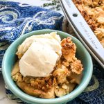 Apple Crisp in a blue bowl.