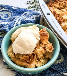 Apple Crisp in a blue bowl.