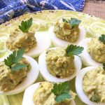 Avocado Deviled Eggs topped with parsley.