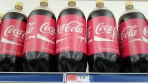Here's The Real Reason Coca-Cola Bottles Sometimes Have Yellow Caps