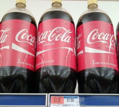 Here's The Real Reason Coca-Cola Bottles Sometimes Have Yellow Caps